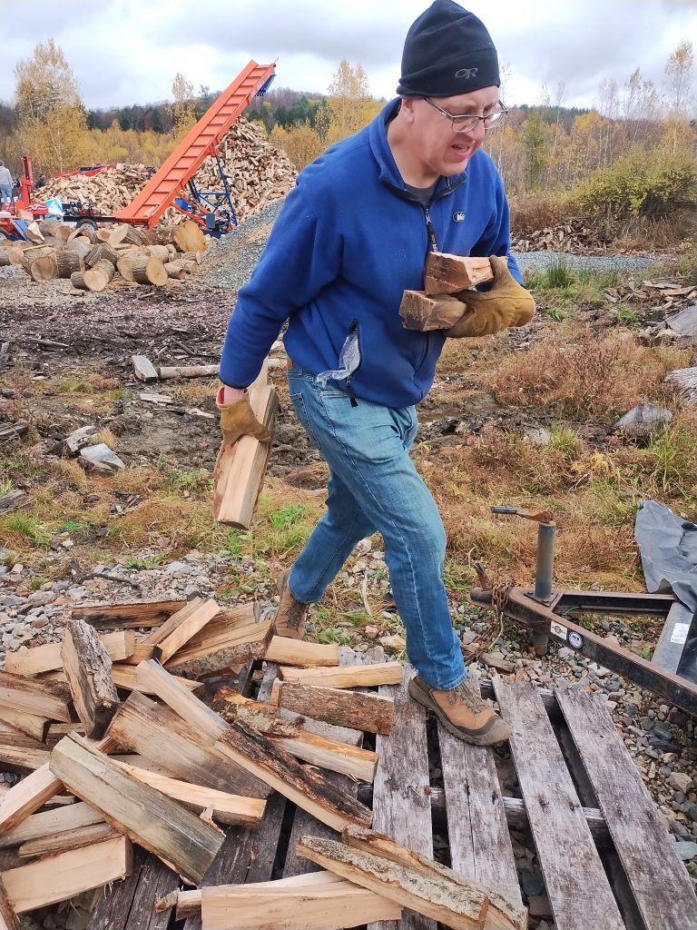 moving wood with church at the well vt volunteers